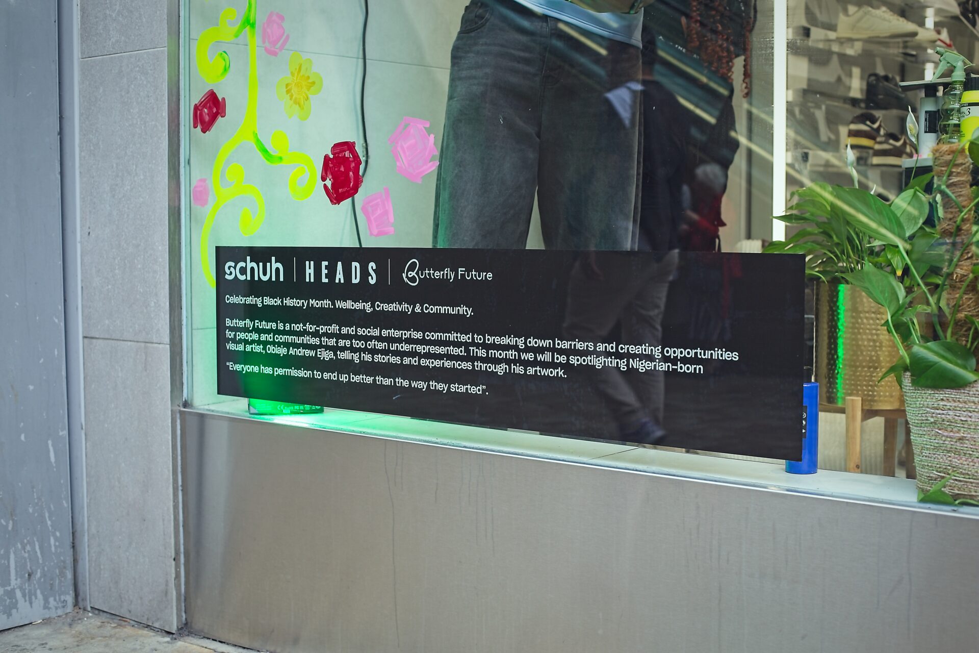 schuh x HEADS x Butterfly Future sign on the Market St store window.