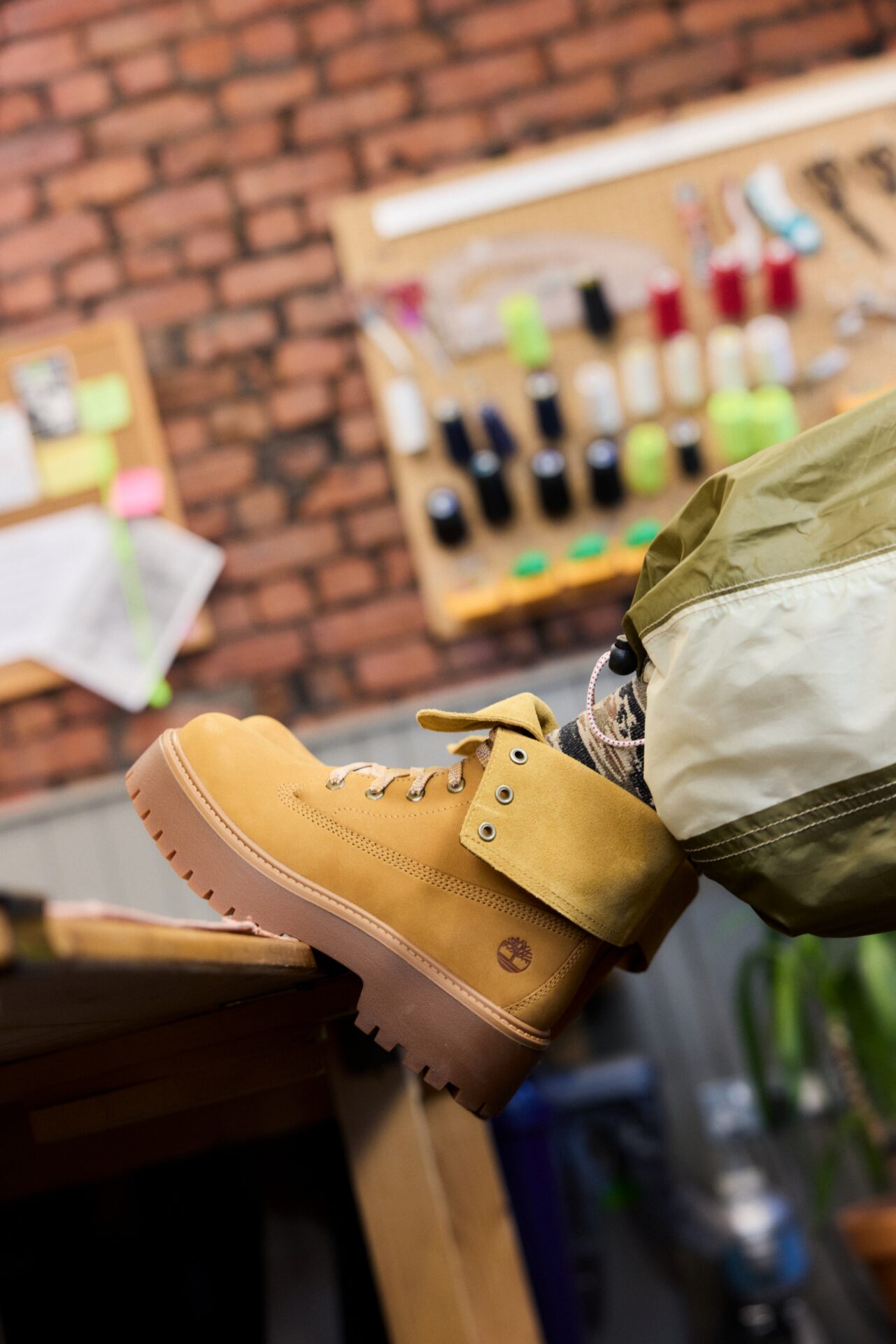 Close up of Timberland Stone Street Mid Lace in Natural worn by Campaign star J.O.Studio.